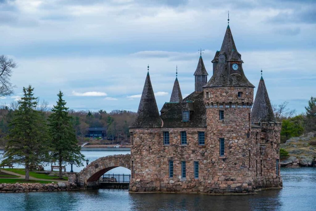 Boldt Castle rising above the St. Lawrence River on Heart Island, New York, with boats in the water.