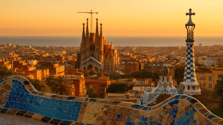 Barcelona All-Inclusive Pass: Aerial view of Barcelona cityscape at golden hour, showcasing the Sagrada Família and Park Güell in the distance.